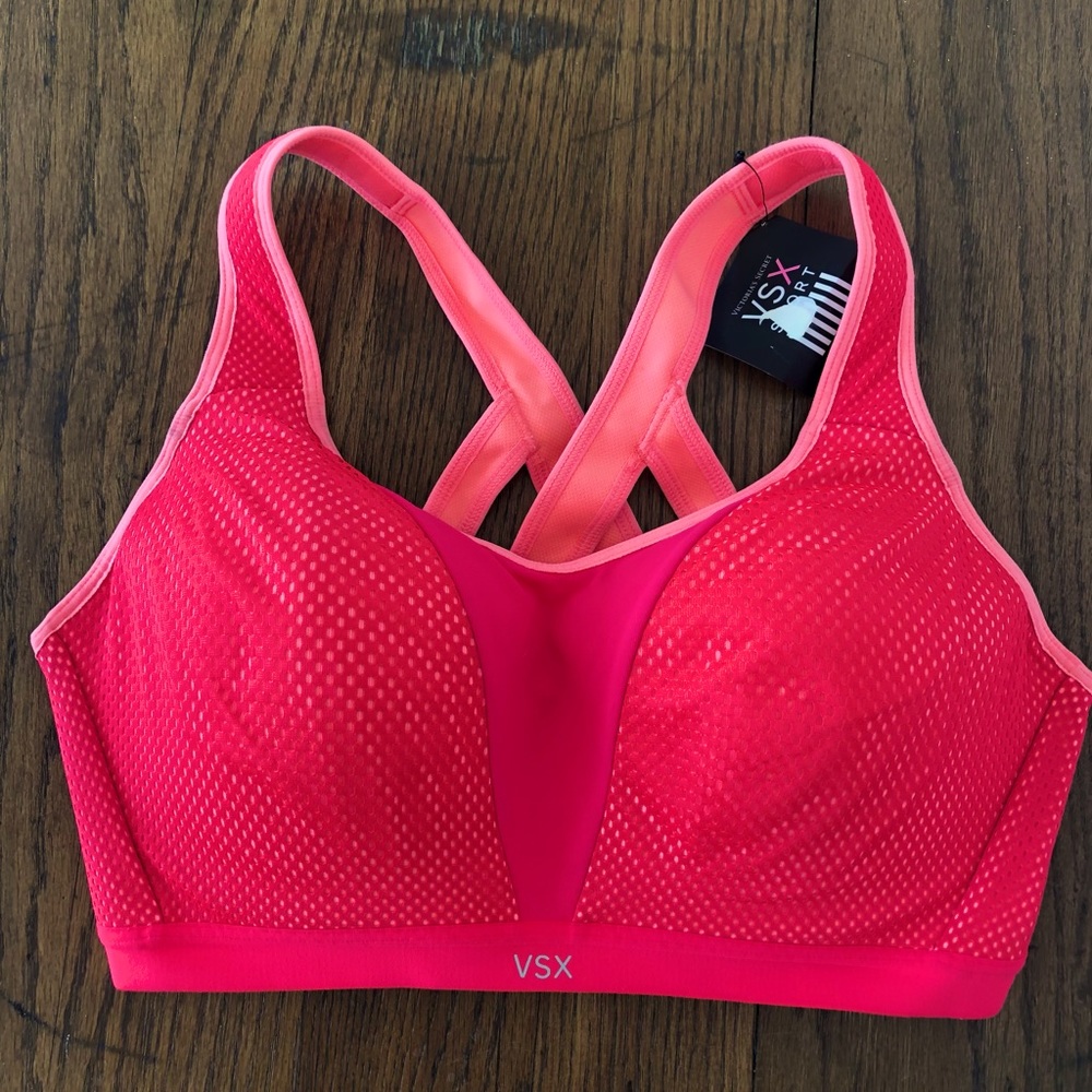 New w/ Tags. Victoria’s Secret sports bra. 38D. Max support. Bright pink & coral